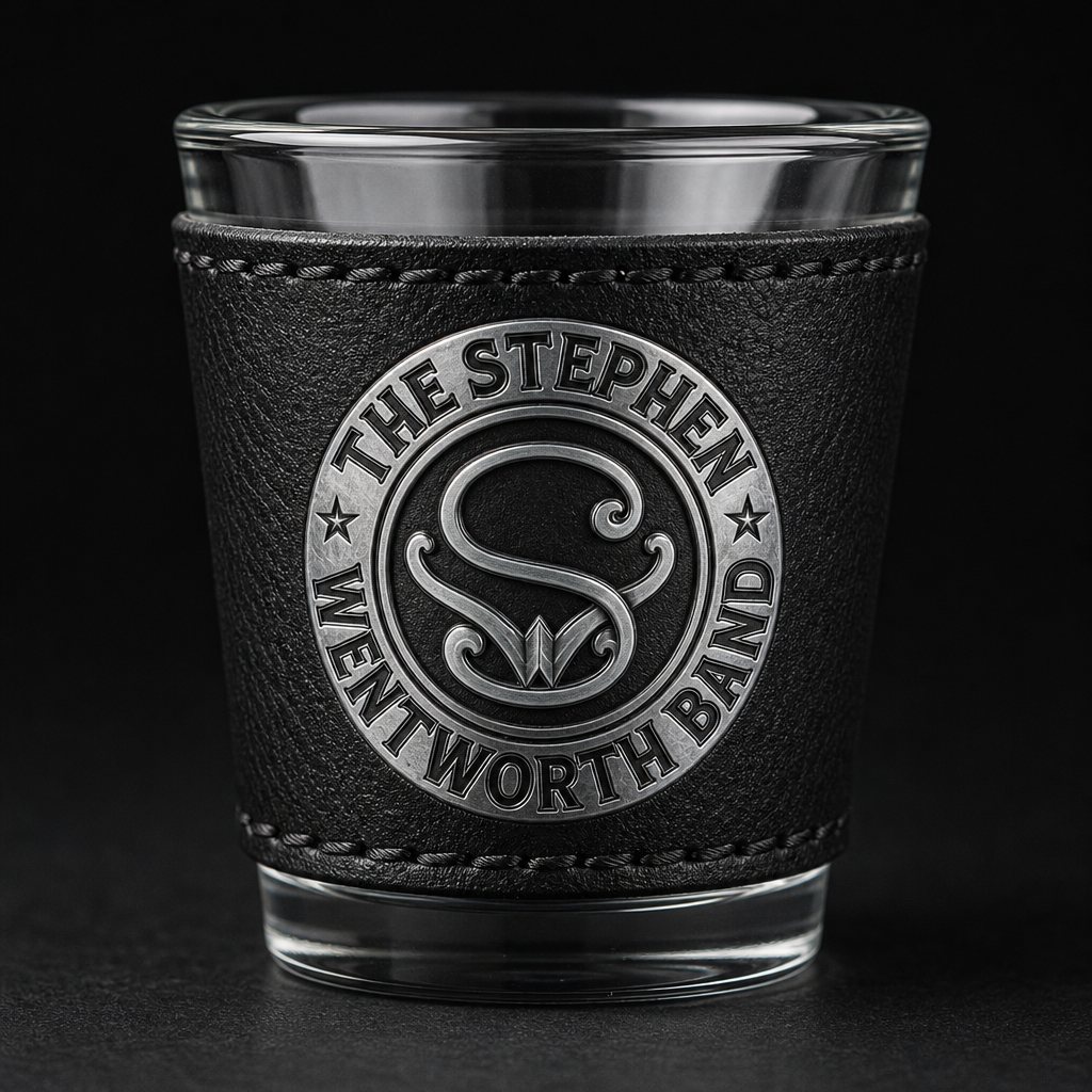 Shot glass wrapped in black leatherette with the band emblem